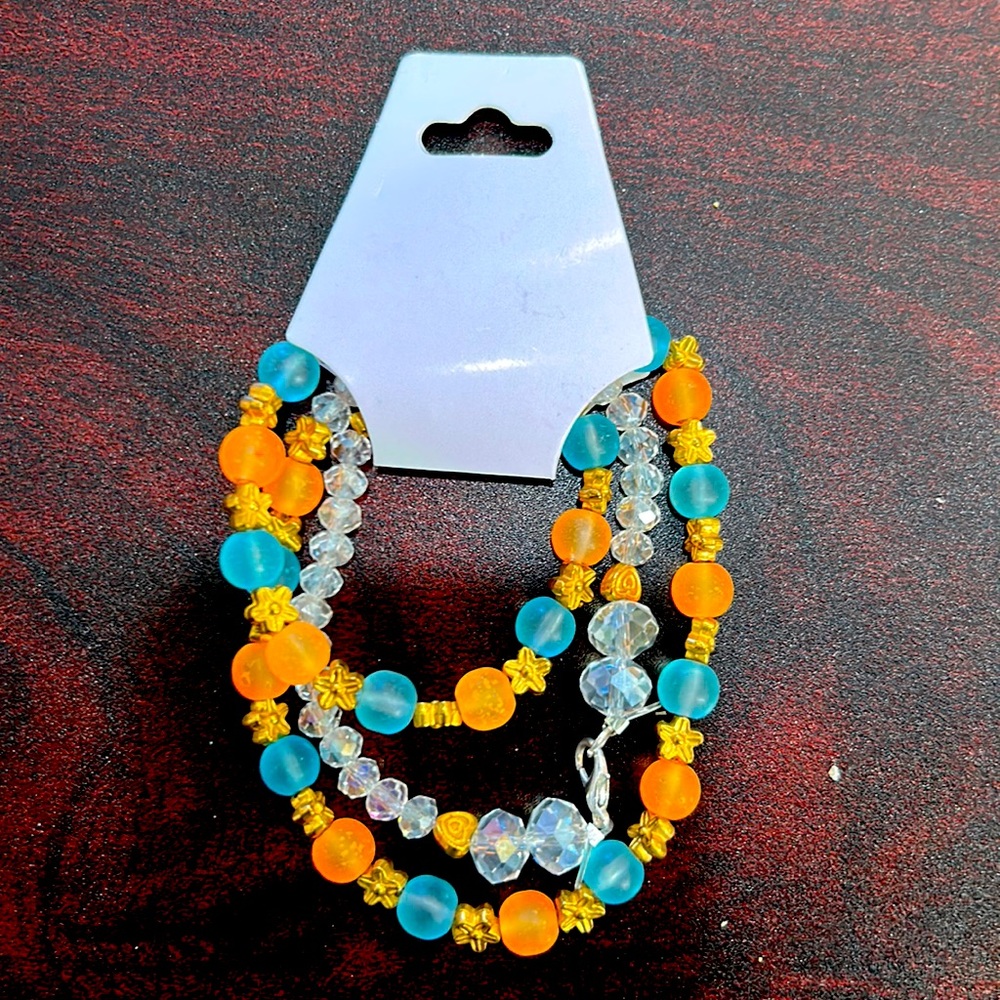 22 1/2in light blue and orange belly chain with white crystal beads